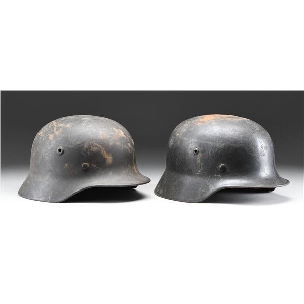 2 WWII GERMAN HELMETS.