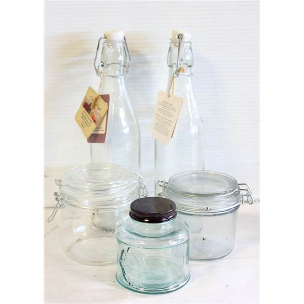 FLAT OF FANCY GLASS JARS AND BOTTLES