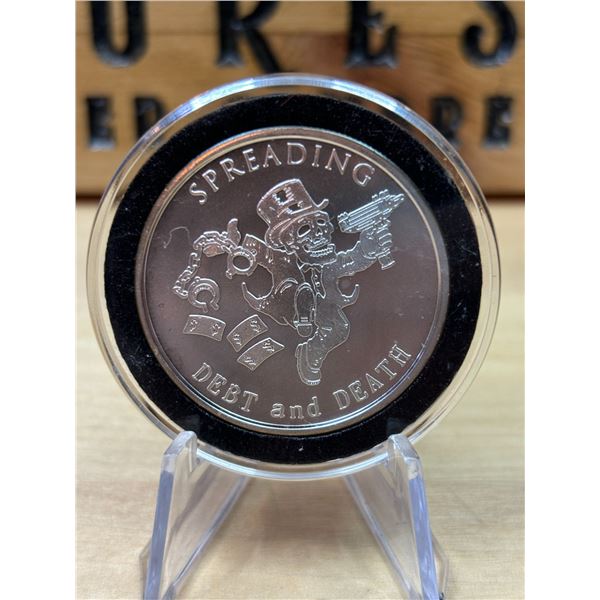 Lot 10-1) 1 oz Spreading Debt and Death silver round