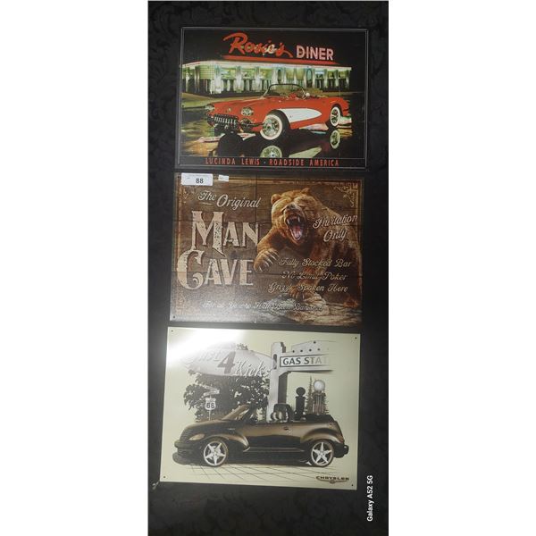 3 metal man cave signs