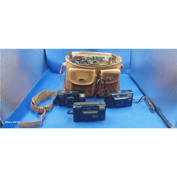 Hand carved leather Mexican camera bag containing several vintage cameras