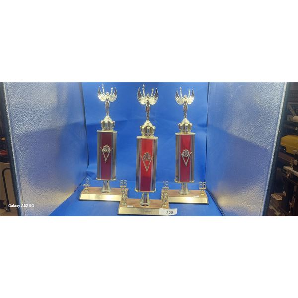 Lot of three 1986 car trophies 18" each