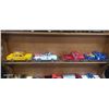Image 3 : 13 die cast trucks on wooden rack, each truck approx 5"