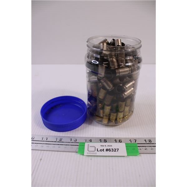 Peanut Butter sized plastic Container containing Spent Brass and Nickel Casings. .45 Caliber