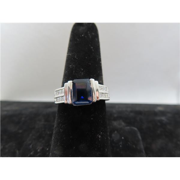 18K WG Sapphire/Diamond Ring w/One Emerald Cut Sapphire and 6 Square Cut