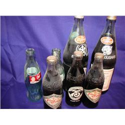 7 Commemorative Coke Bottles