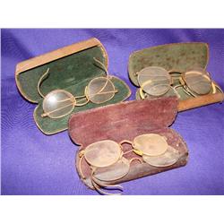 5 pair of old eyeglasses in 3 cases