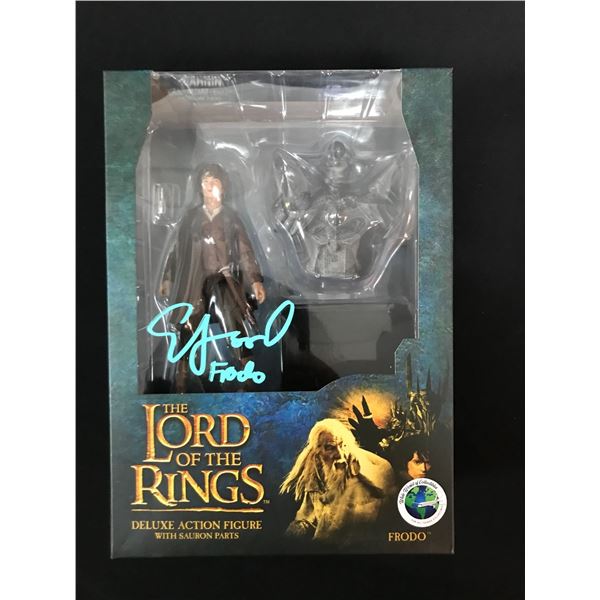 ELIJAH WOOD SIGNED LOTR DELUXE ACTION FIGURE WITH SAURON PARTS (WWOC COA)
