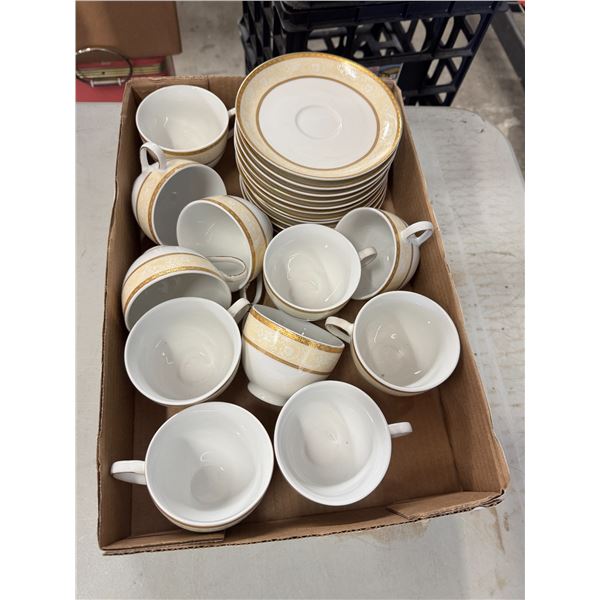 Cups and saucers tea pot and cream and sugar
