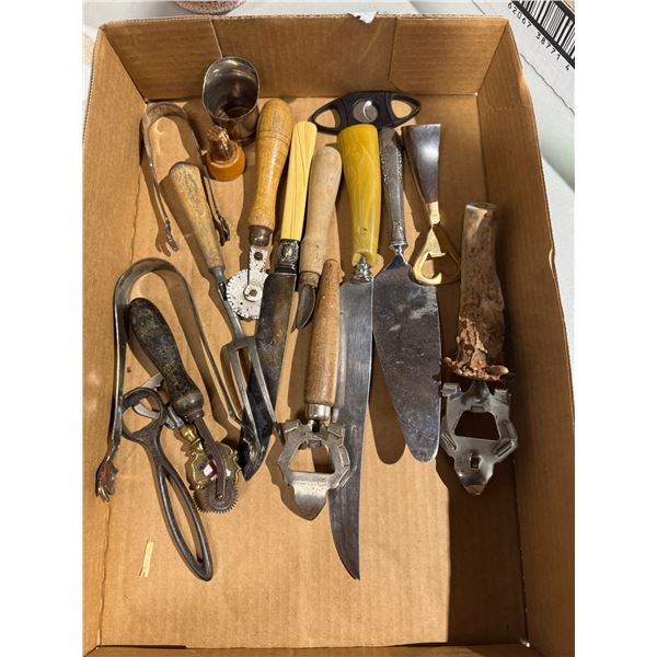 Vintage bottle openers and kitchen utensils