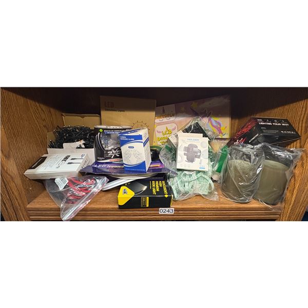 SHELF LOT FULL OF ASSORTED ELECTRONICS AND MISC. - BOOK LITE/ PHONE HOLDER/ ELECTRIC CANDLES/ STRING