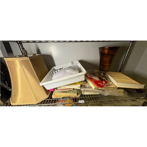 Shelf full of assorted books and misc.