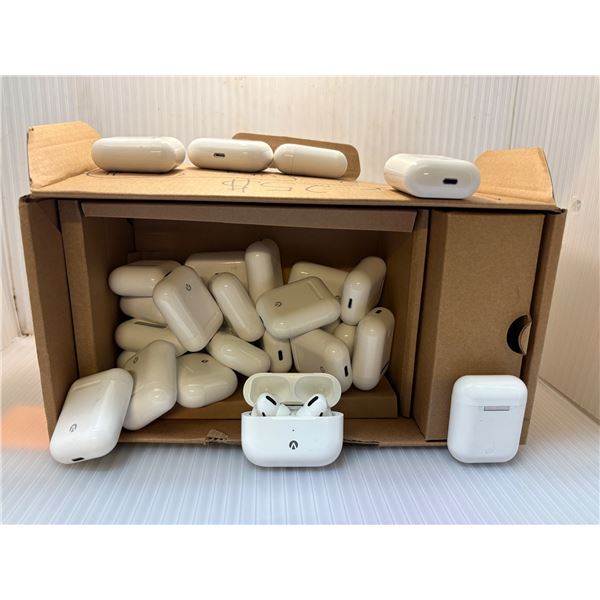 Box full of assorted wireless earbuds