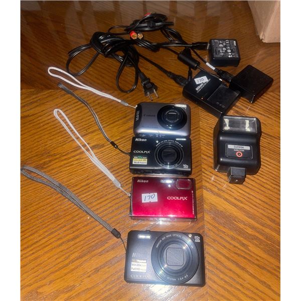 Four Vintage Cameras W/ Chargers for Three  Canon, Nikon +Cords
