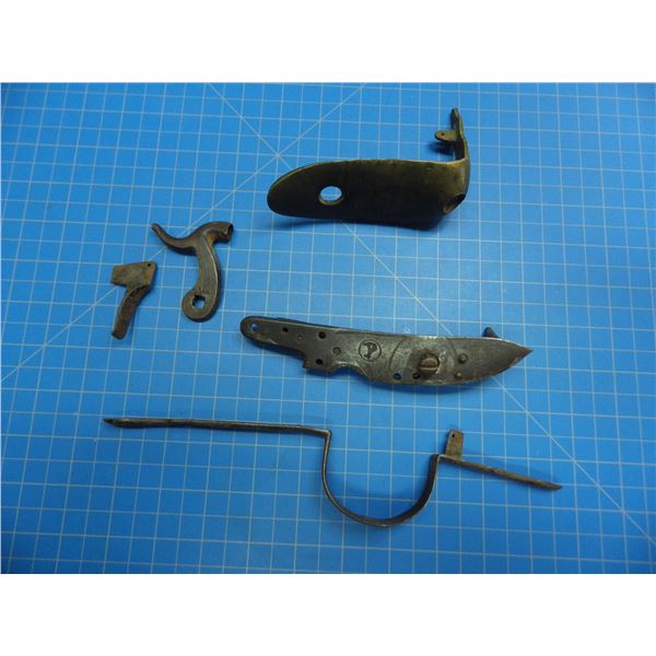 Parts from a Wheeler & Son tradegun consisting of the butplate, trigger guard, trigger, percussion l