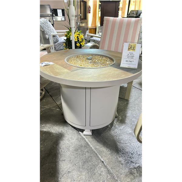 VULSINI 36" ROUND CHAT HEIGHT FIRE TABLE. DRIFTWOOD/QUARRY NATURAL TILE TOP & CHAMPAGNE GLASS.