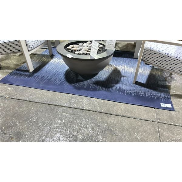 TREASURE GARDEN OUTDOOR RUG. 5'3"X7'4" DESIGNED BY REFLECTIONS. COLOR IS OCEAN BLUE.