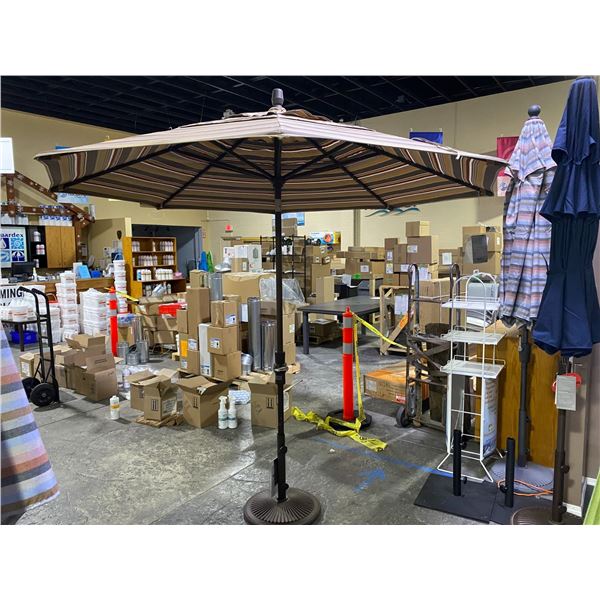 TREASURE GARDEN 9' OCTAGONAL UMBRELLA WITH COLLARED TILT AND WEIGHTED BASE.