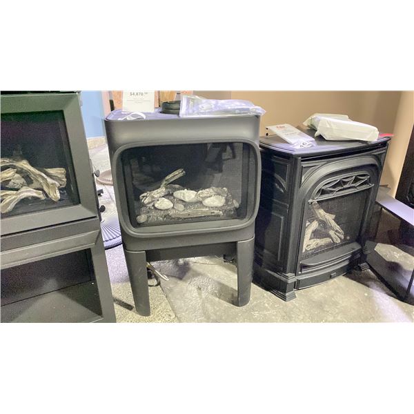 JOTUL GF 305 DV IPI CASTI IRON GAS STOVE AS SHOWN IN MATTE BLACK AND BEACHFIRE LOG SET. HEATS UP TO
