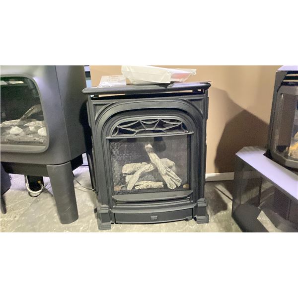 VALOR PRESICENT FREESTANDING GAS STOVE AS SHOWN WITH FLUTED BLACK LINER AND DRIFTWOOD LOG SET.