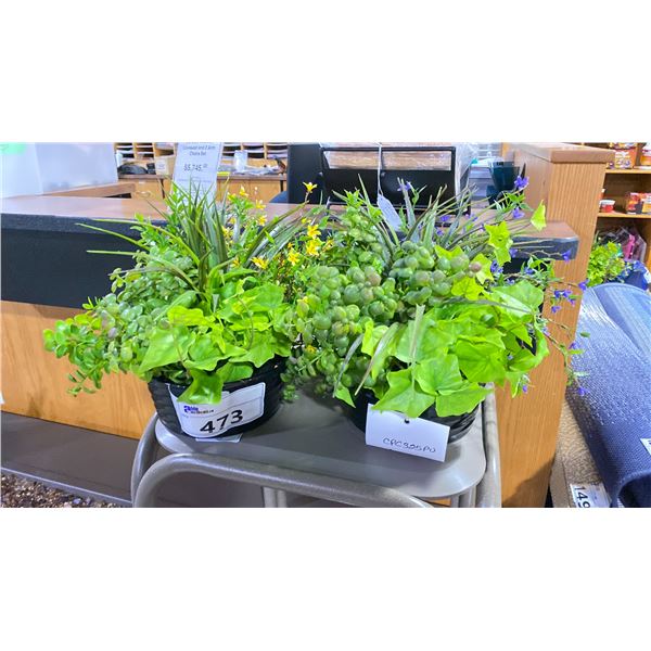 TWO ARTIFICIAL TABLE TOP PLANTS. ONE OF THE POTS HAS A CRACKED PIECE THAT COULD BE GLUED BACK IN