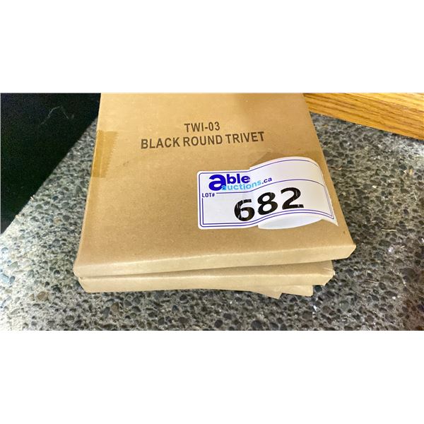 GROUP OF 4 BLACK ROUND CAST IRON TRIVETS RETAIL $300