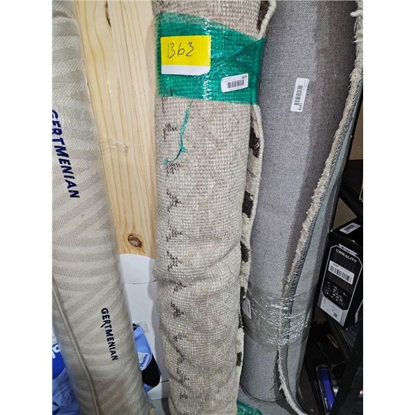 Rolled Area Rug With Patterned Design