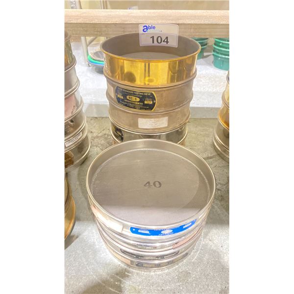 STACK OF COMMERCIAL LABORATORY TEST SIEVES IN ASSORTED SIZES NO 6 - 320