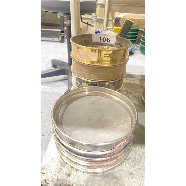 STACK OF COMMERCIAL LABORATORY TEST SIEVES IN ASSORTED SIZES NO 104 - 325