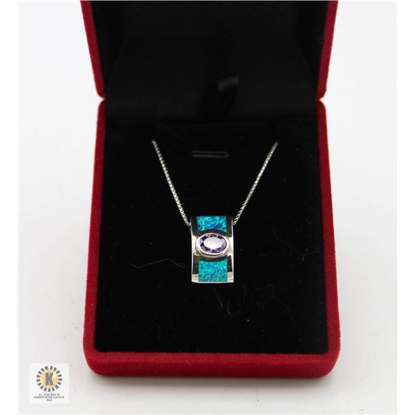 #2309-HAND SET OVAL NATURAL TANZANITE