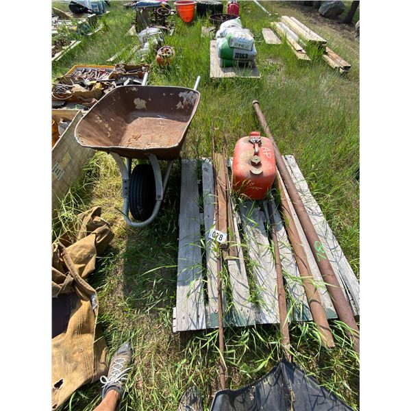 AP pallet with a Fuel Tank , misc angle iron , pipe , crowbar & wheel barrel