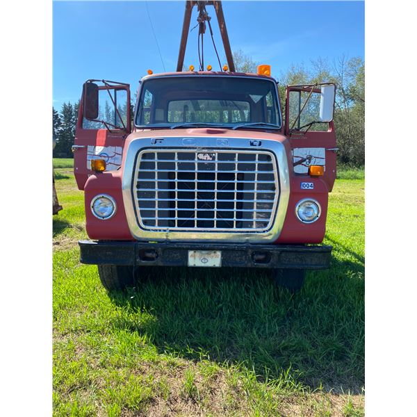 1975 Ford 750, Single Axle, s/n: N76FUX91035 c/w 11ft. Deck, winch, 6in. Poles, V8, 5 & 2 spd., C.B.