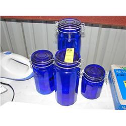 Four Blue Cannisters