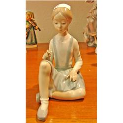 Lladro Girl with Flower (Ankle has been glued)
