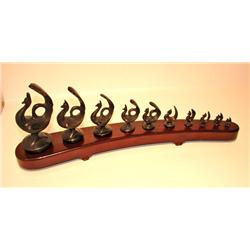 Iron Peacock in a Row