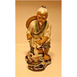 Porcelain Man with Bird