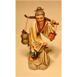 Porcelain Woman Carrying Food