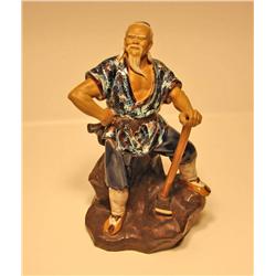 Porcelain Man with Pick Axe