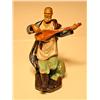 Image 1 : Porcelain Man Playing Instrument