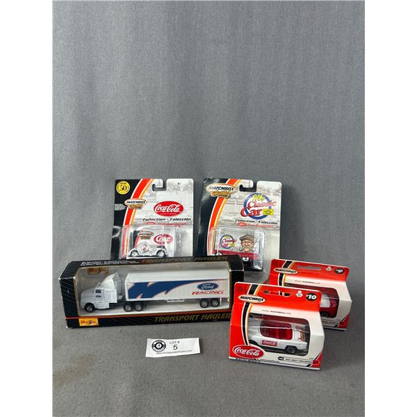 Die Cast Metal Collectibles In Original Packages- 3 Coca Cola Matchbox, 1 Dennis Gage Matchbox & 1 M