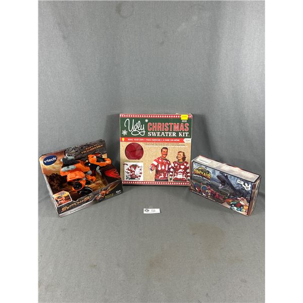 3 Items In Original Pkgs - vtech T-Rex Race Car, Dinosaur Painting Pull Back Car & Ugly Sweater Maki