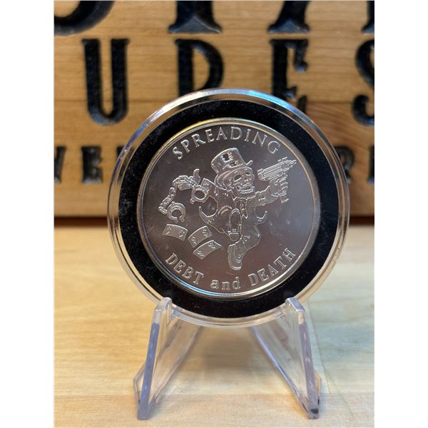 Lot 45-1) 1 oz Spreading Debt and Death Silver round