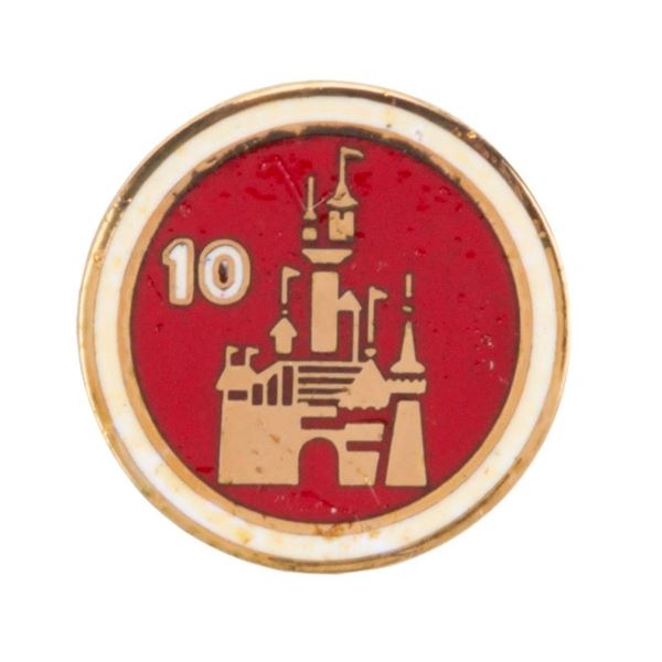 A Disneyland Cast Member 10 Year Service Pin.