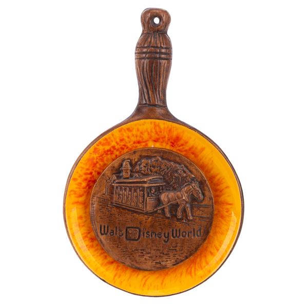 A Walt Disney World Frying Pan Wall Decoration.