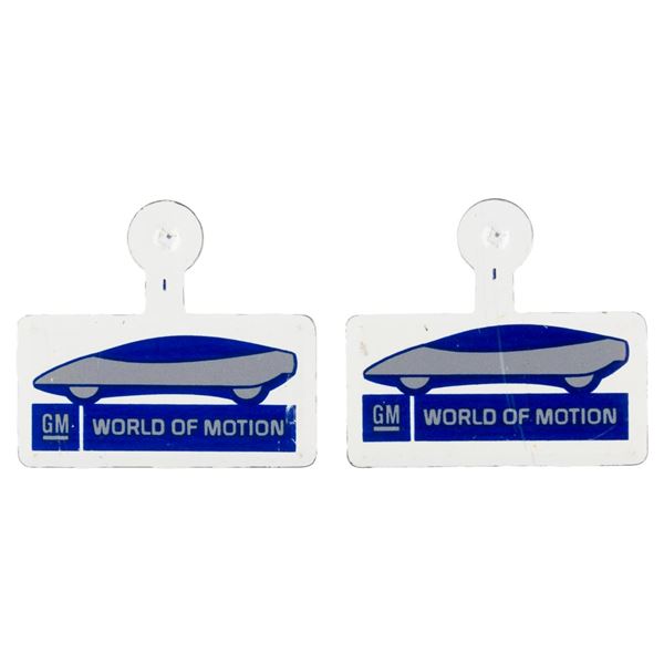 A Pair of EPCOT World of Motion Metal Badges.