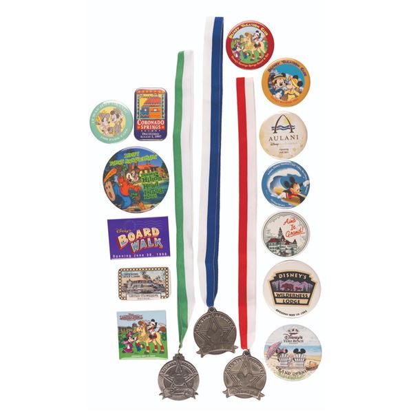 A Collection of Disney Resorts Buttons and Medals.