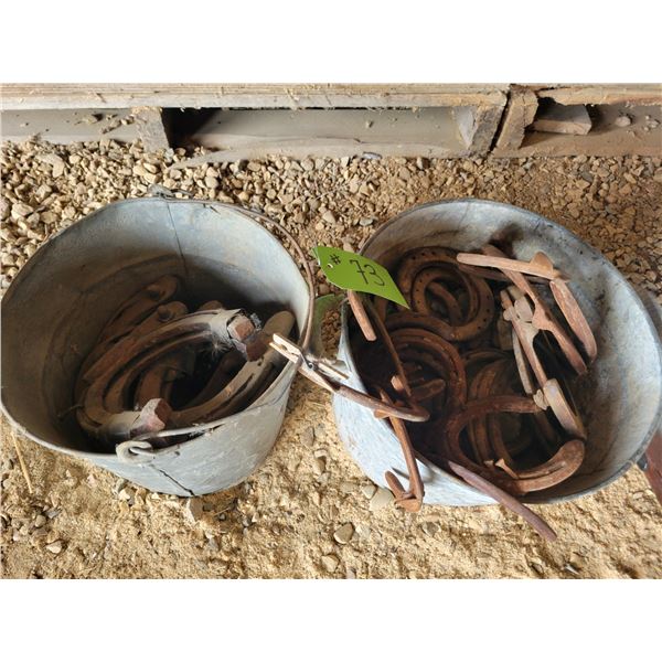 2- Pails of horse shoes