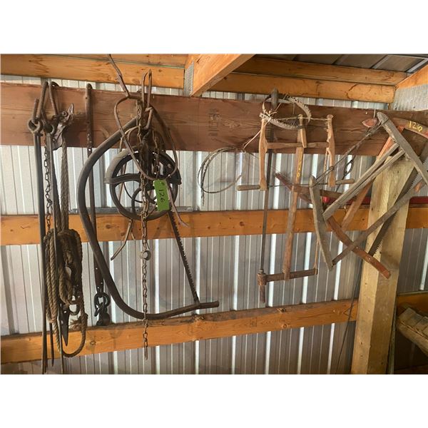 Approx. 4 Old Saws, Well Pully, Steel Rods, & Wire Stretcher