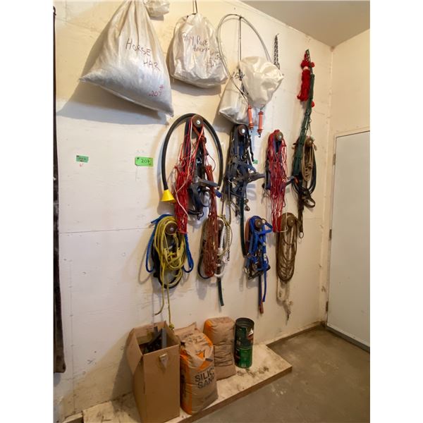 Qty of hay nets, small rope halters, horse hair, misc. halters, 3- bags of silica sand