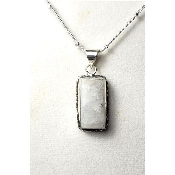 24)  SILVER TONE SETTING WITH NATURAL